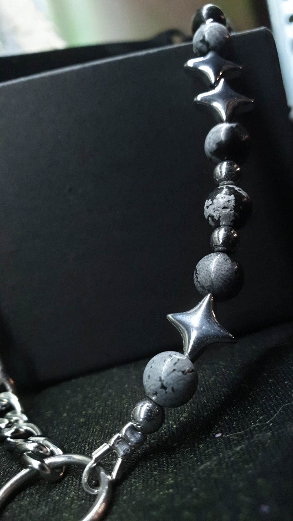Close-up of RAVEBOUND handcrafted North Star necklace