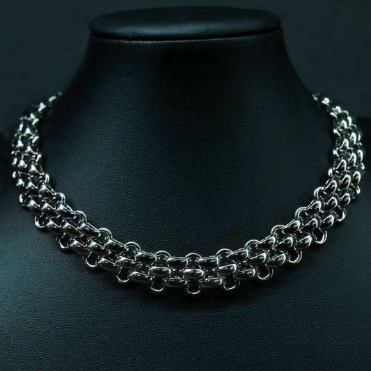 Front view of the stainless steel flat weave chain with a structured, low-profile interlocked design.