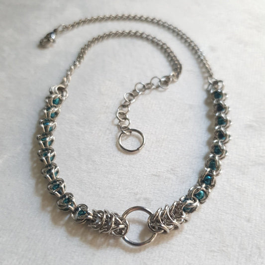 Handmade stainless steel captured bead chainmail choker with teal glass pearl beads and front O-ring.