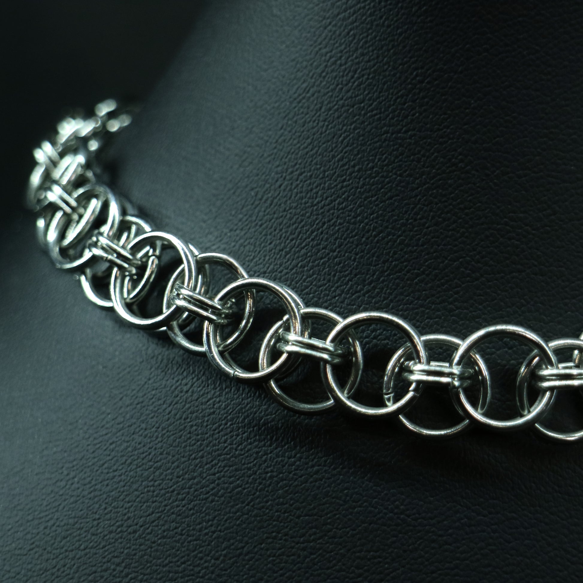 Side close-up of the handcrafted stainless steel chainmail choker showing its detailed ring-link construction.
