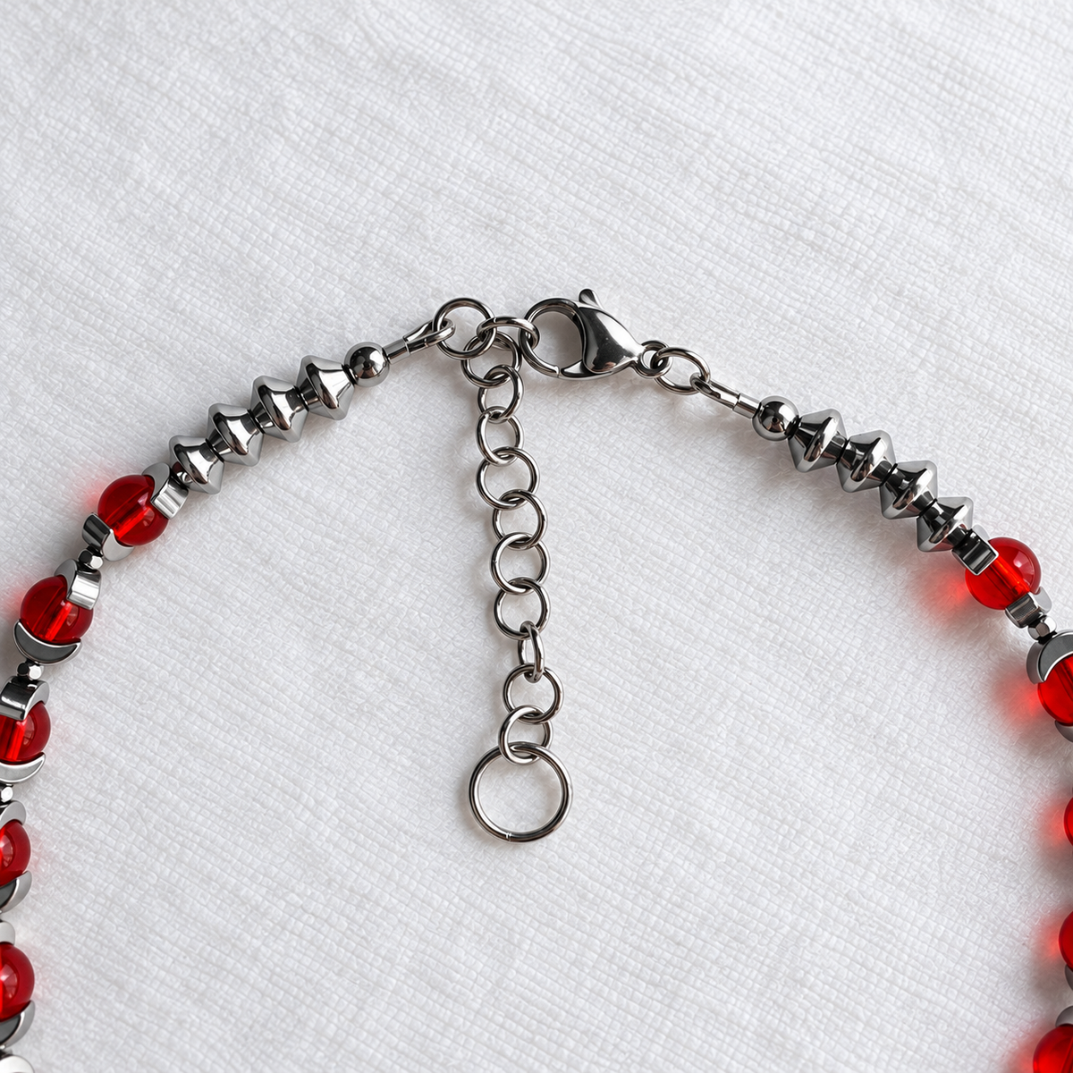CELESTIA stainless steel lobster clasp and adjustable extension chain with round ring ending.