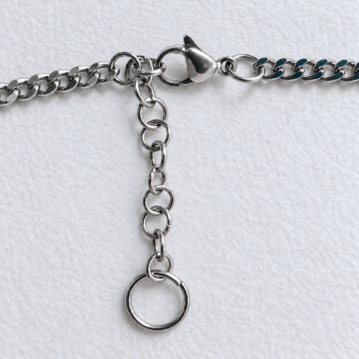 ECHO stainless steel lobster clasp and adjustable extension chain with round ring ending.