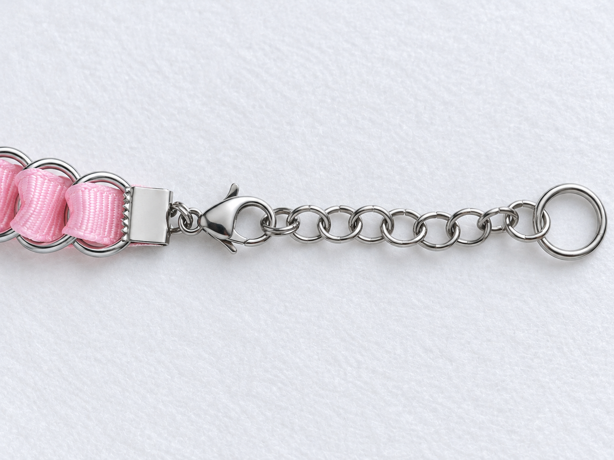 LOOM baby pink choker fastening detail showing stainless steel ribbon clamp, lobster clasp, extension chain and end ring.