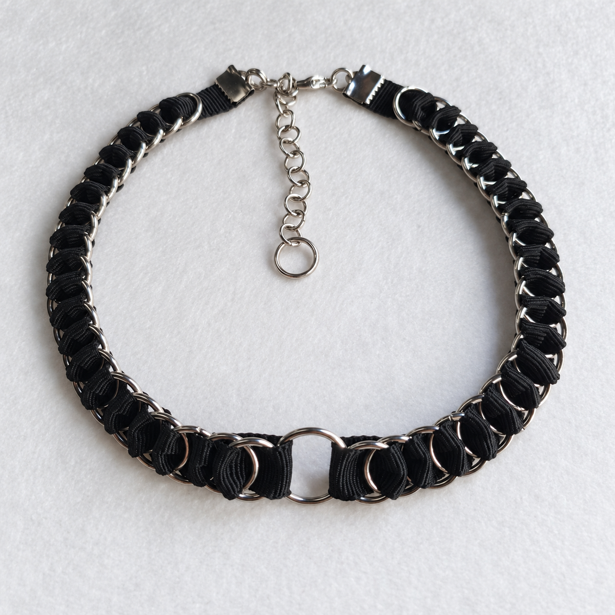 Full LOOM black fabric ribbon chainmail choker with stainless steel rings, central O-ring, clasp and extension chain.