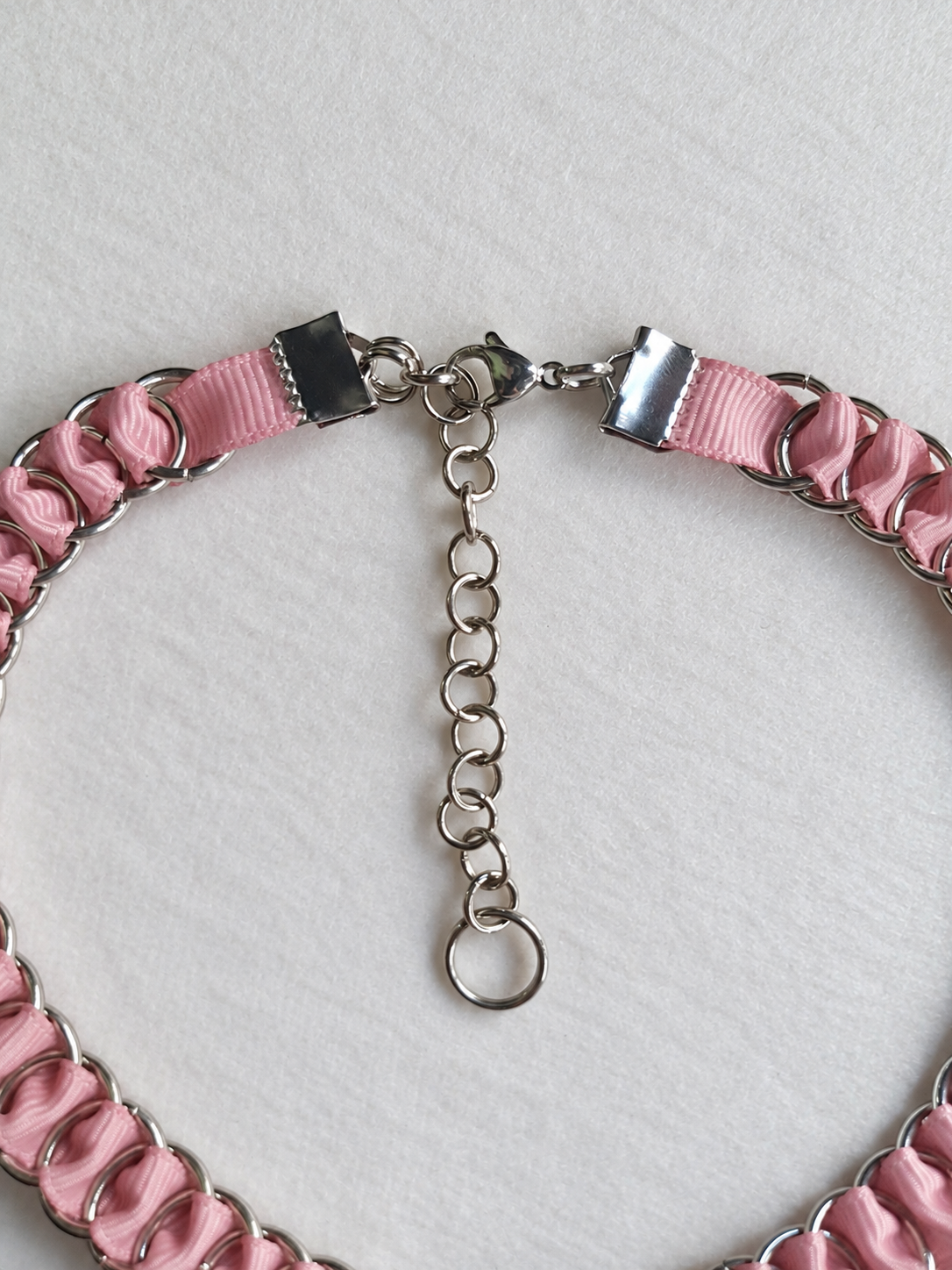 LOOM dusty pink choker closure with stainless steel ribbon clamps, lobster clasp, adjustable extension chain and end ring.