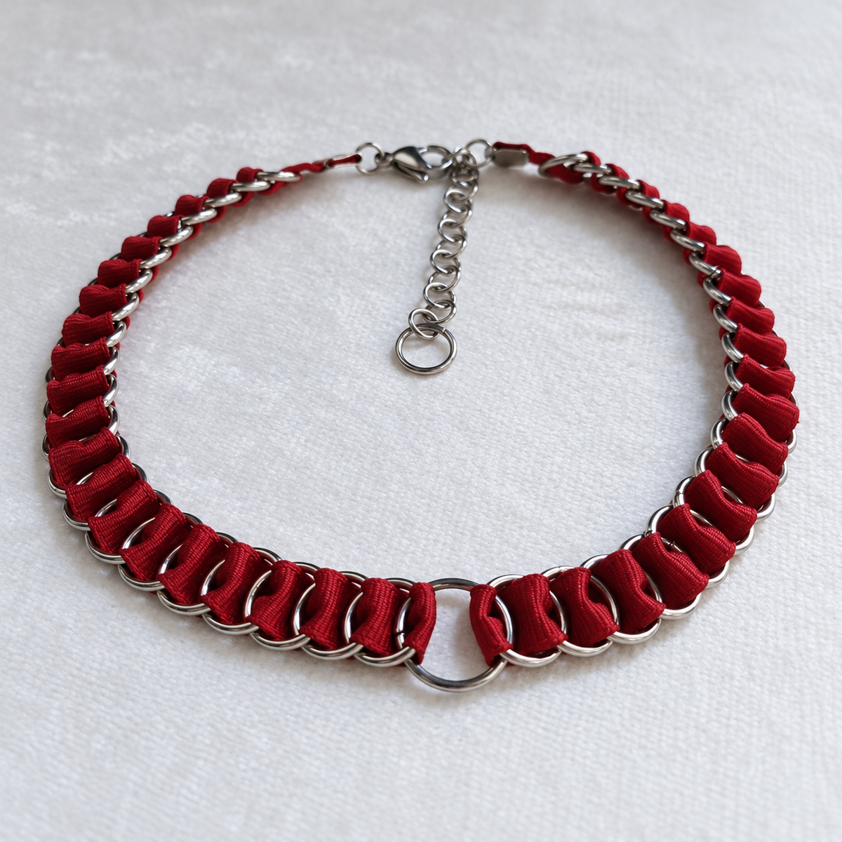 Full LOOM red fabric ribbon chainmail choker with stainless steel rings, central O-ring, clasp and extension chain.