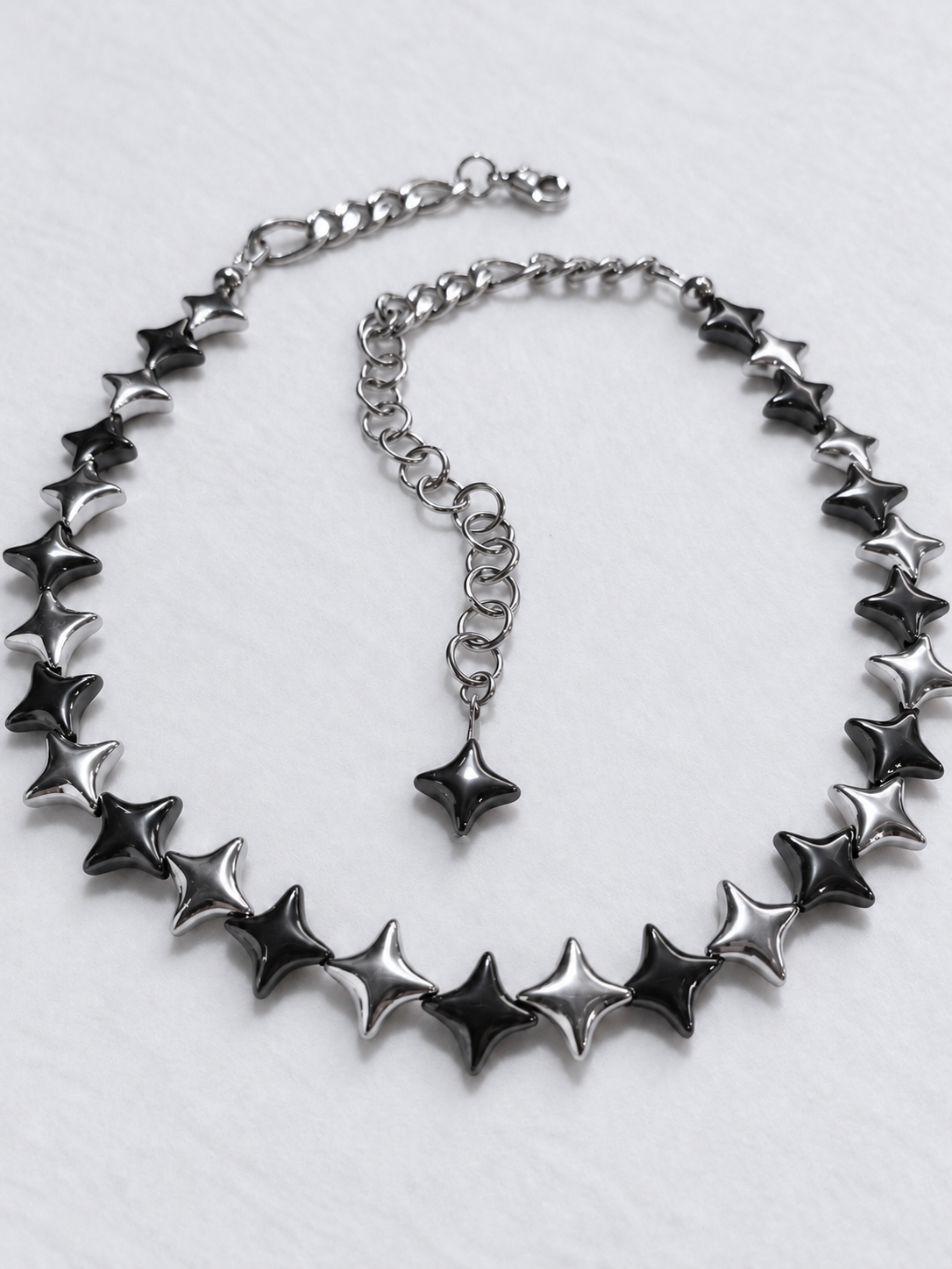 NORTHLINE Mixed choker front view with alternating silver and gunmetal North Star hematite beads and a star-tipped stainless steel extension.