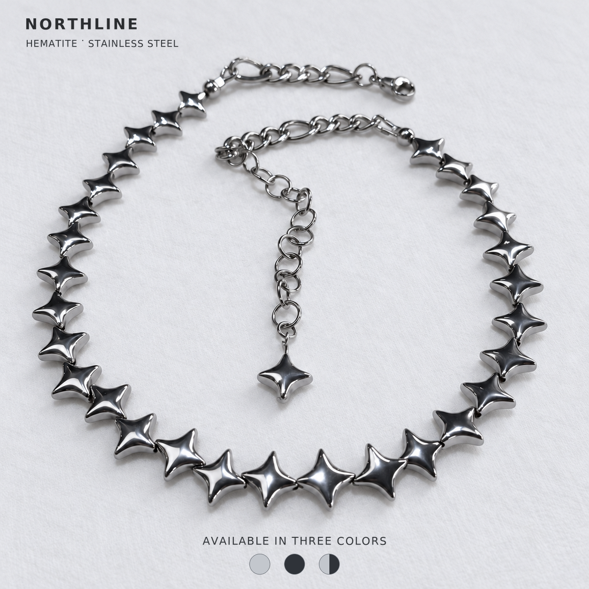 NORTHLINE Silver North Star hematite choker with stainless steel chains and star-tipped extension. Cover reads Hematite · Stainless Steel and Available in Three Colors, with Silver, Gunmetal and Mixed swatches.