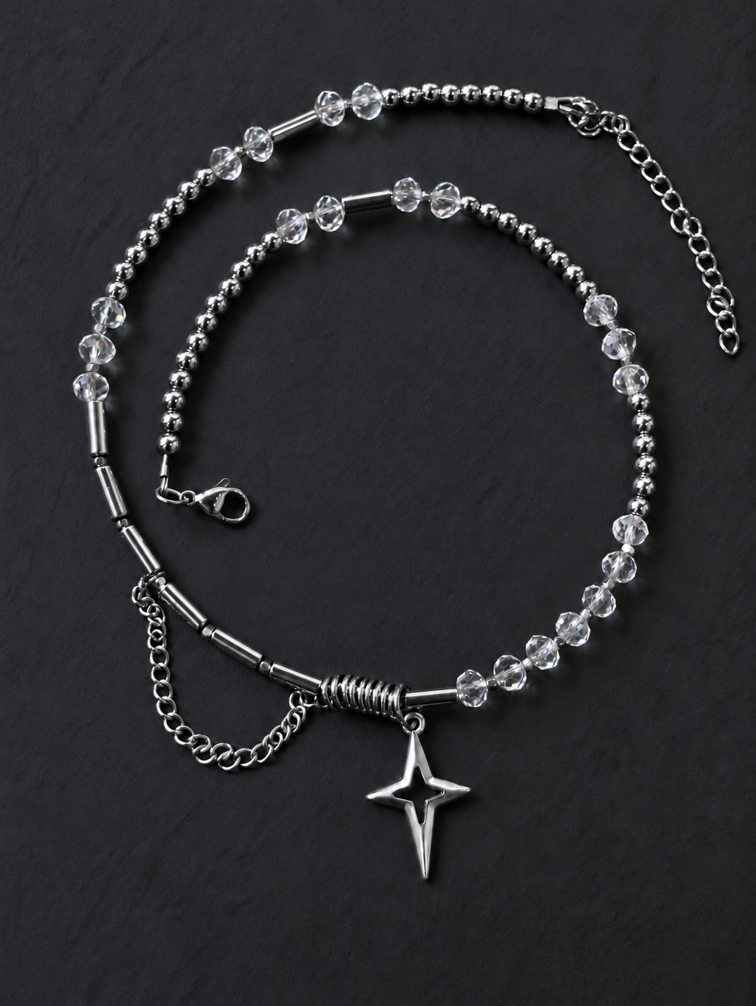 Overhead view of SPECTRAL ARC showing its complete bead arrangement, silver-plated North Star pendant, lobster clasp and extension chain.